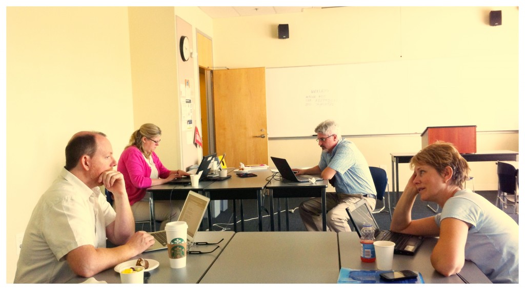 BCOER librarians at our mid-summer day's hackfest:  Brenda Smith, TRU and Martin Warkentin, UFV (background) and Kevin Stranack, PKP and Caroline Daniels, KPU (foreground)